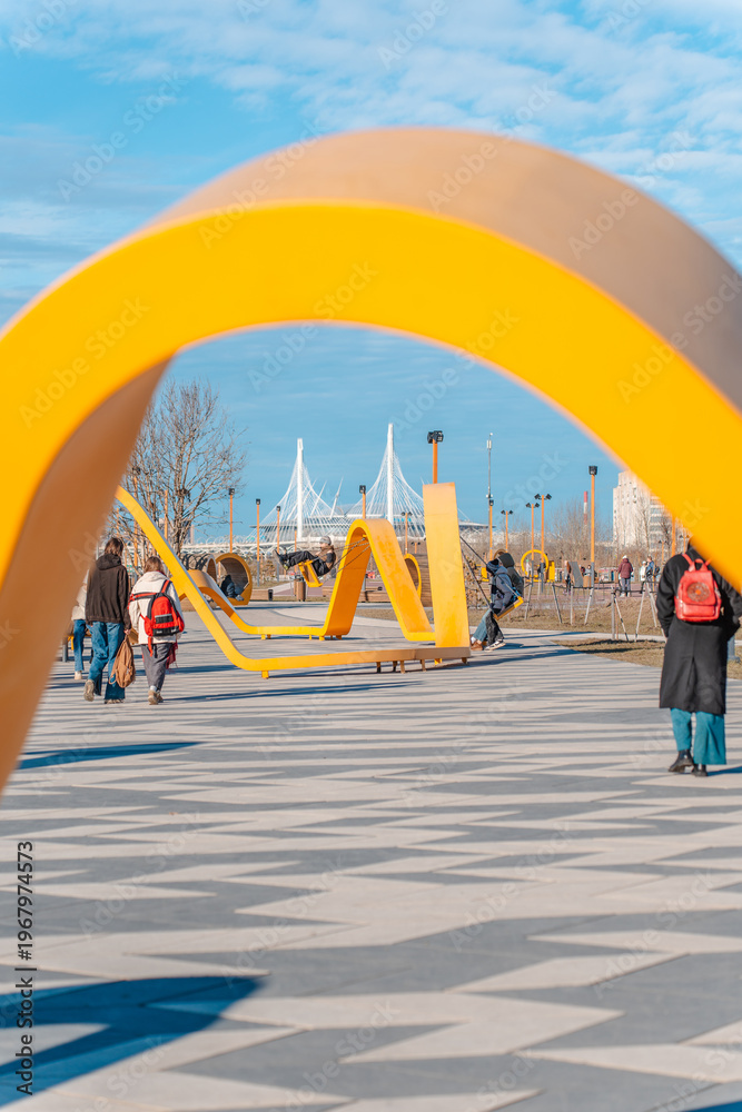 Fototapeta premium Beautiful modern urban outdoor park in spring. Saint Petersburg, Russia - 16 March 2026