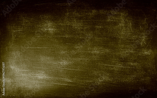 A wall with a rough, textured surface. The wall is brown and has a lot of dirt and grime on it. 