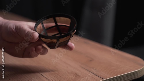Coffee preparation procedure. Pour the coffee into a strainer
