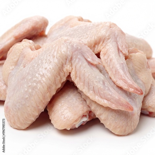 Raw chicken wings on a white background, fresh and ready for cooking or preparation in a kitchen setting