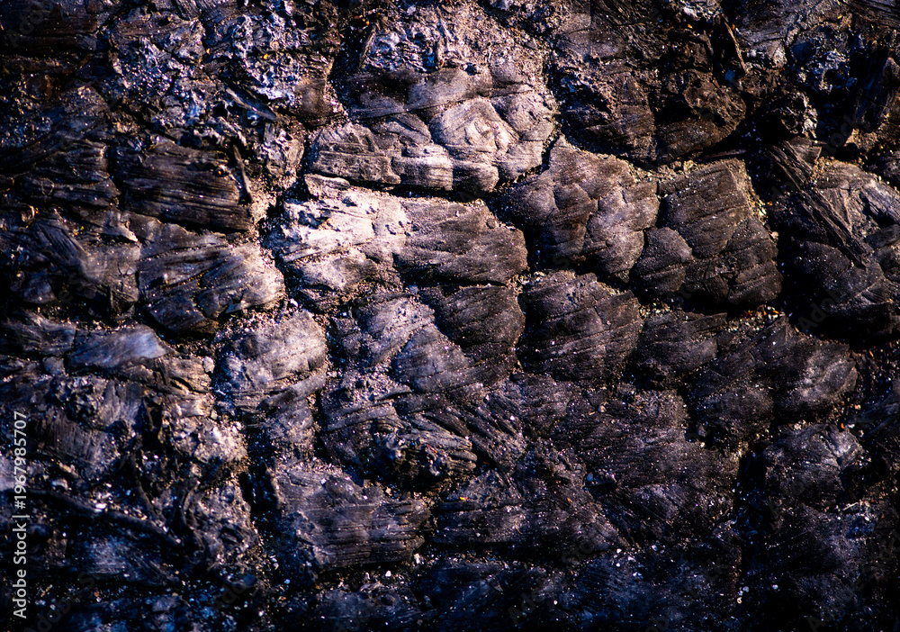 Fototapeta premium Lava rugged texture with crack formation. Lava macro closeup with mineral detail. Lava cooled surface with dark pattern. Lava natural abstract background.