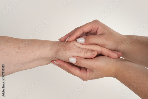 Care for aged hands. Hand help holds hands. Hand help links family. Hand help shows respect. Hands help connection. Support aged with tenderness. Hand old and young touch.