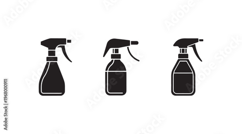 Black and white spray bottles with different shapes and sizes  cleaning supplies  household items