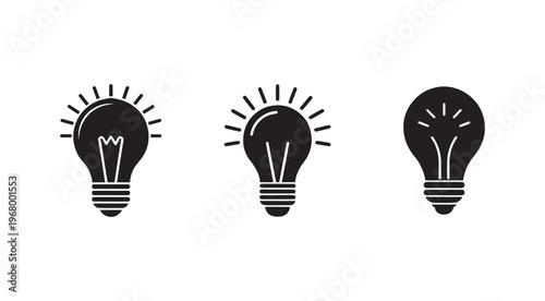 Black light bulb icons with rays on white background  lightbulb symbols  ideas and inspiration concept