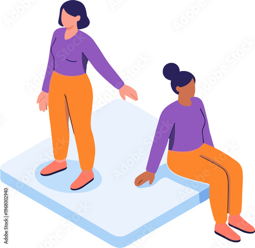 Two women interact on a large mattress in a casual setting.
