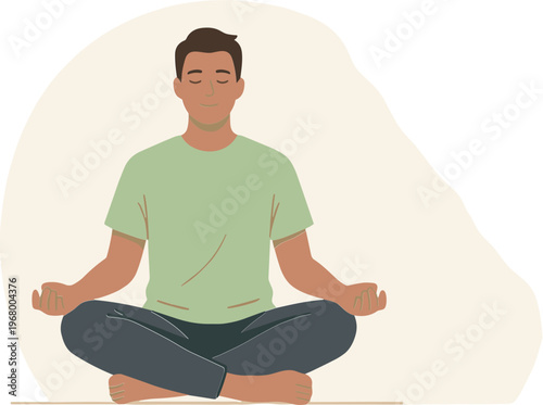 A man sits cross-legged in meditation on the floor indoors