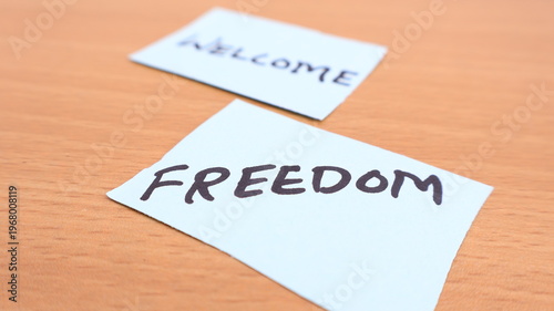 Freedom Note on Paper, Close-up on Wood