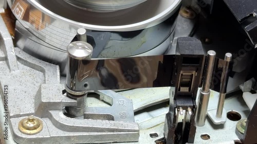 Wallpaper Mural The internal drum and reels rotate during playback, creating a steady mechanical whir. When stopping, the loading mechanism engages to eject the VHS tape, producing rhythmic gear clicks Torontodigital.ca