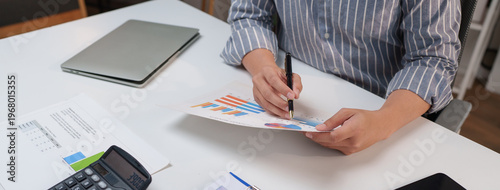 Person analyzing financial data charting business growth