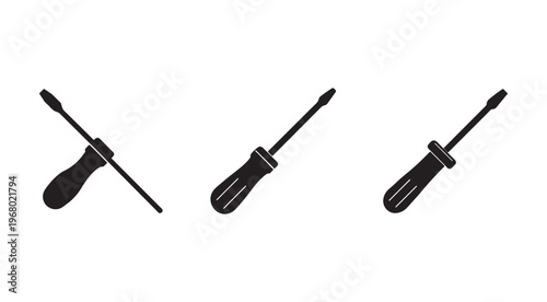 Three black screwdrivers with handles and screwdriver tips on white background  tools for repair and maintenance