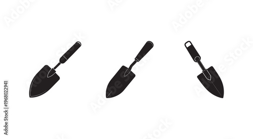 Three black silhouettes of garden trowels with different handles on white background  isolated gardening tools