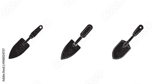 Three black trowels with handles on white background for gardening and construction work tools