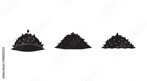 Three piles of coal or charcoal with different shapes and sizes on a white background for design or illustration purposes