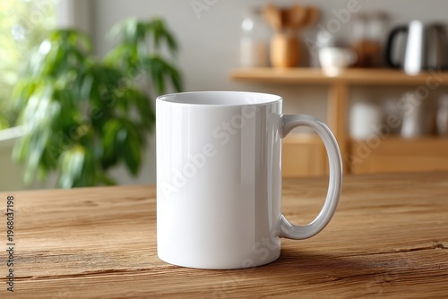 White ceramic coffee mug on wooden table in cozy kitchen interior, side handle visible, soft daylight, blurred shelf with kettle and bowls, green houseplant