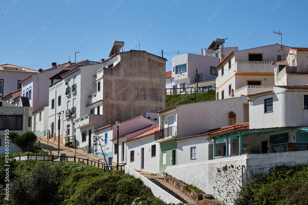 Fototapeta premium Sunlit hillside village houses in Portugal
