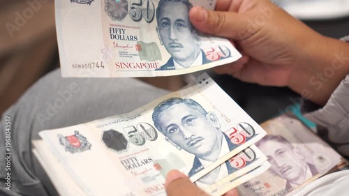 Banknote counting Singapore dollars SGD, Singapore money for payment