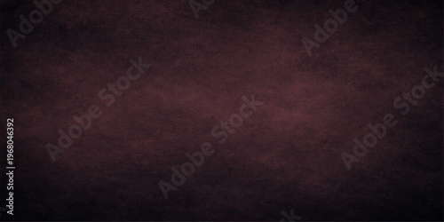 Abstract a dark, textured burgundy background, offering a versatile canvas for design. The image showcases the richness of a simple, solid backdrop.