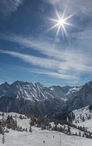 European Alps at skiing area Brandnertal, snowy mountains with blue sky