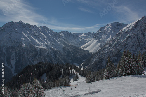 European Alps at skiing area Brandnertal, snowy mountains with blue sky