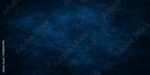 Abstract a dark blue, textured backdrop. Ideal for showcasing text or imagery, the image conveys a sense of depth, with soft gradations and subtle light effects. 