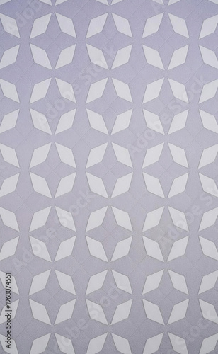 A repeating seamless geometric pattern of interlocking diamond shapes on a pale lavender background