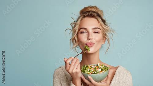 Beautiful Woman Eating Fresh Salad, Healthy Lifestyle Portrait with Natural Makeup and Clean Background