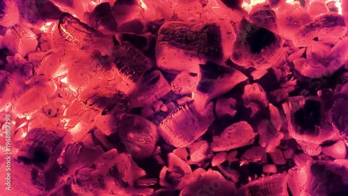 Burning firewood in the fireplace. BBQ fire. Charcoal background. Charcoal fire with sparks. Fire background.