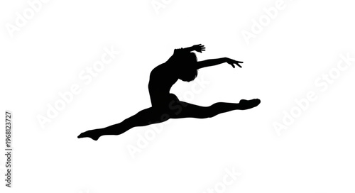 Silhouette of a female ballet dancer performing a grand jet? leap.