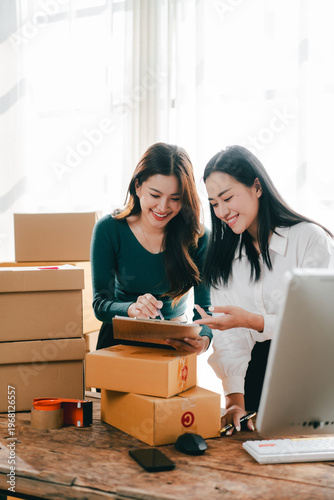 Small and medium-sized enterprise (SME) business owners are checking inventory, packing goods, and preparing for shipment.