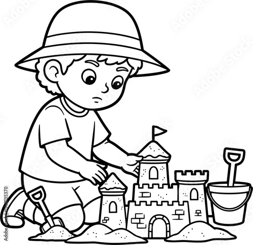 Boy building sand castle on beach.