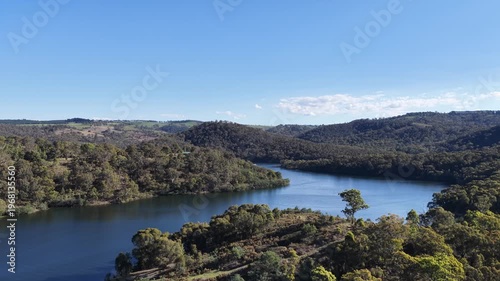 Drone lake forest with speed boat in the distance