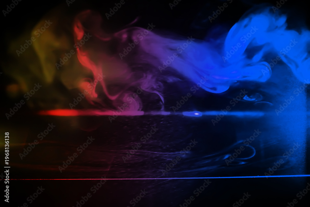 Fototapeta premium colorful smoke on dark background. Color steam on a black background. Red and blue smoke. Copy space.