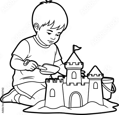 Little boy building sand castle.