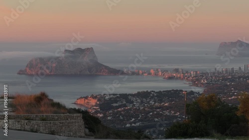 Misty sunrise over Calpe bay and Rock de Ifach