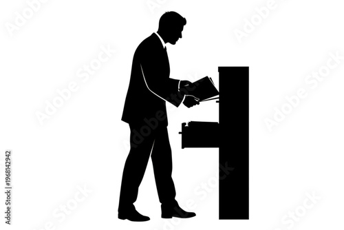 A Moment of Documentation: A person stands beside the copier in the silhouette, focused on printing. A concise representation of daily activity.