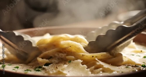 Spaghetti with cheese being served.
