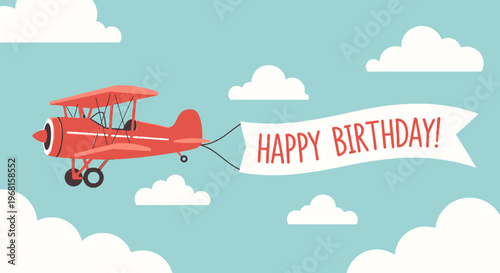 A red biplane flies across a light blue sky with white clouds, pulling a banner