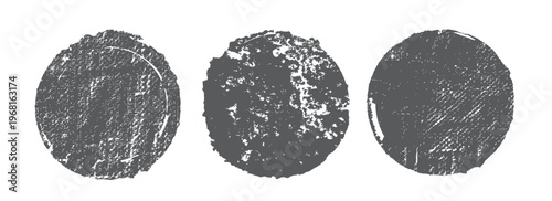 Set of three distressed circular grunge texture elements perfect for vintage design projects and abstract backgrounds