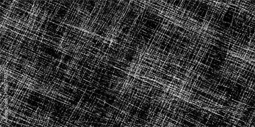 A textured metal grid overlaying a rough black and white grunge material with the natural woven pattern of old brown burlap and linen fiber textile