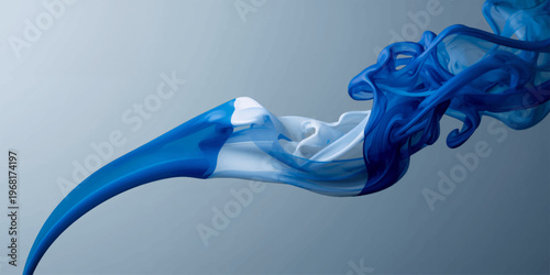 Abstract blue smoke swirls in a smooth motion creating a soft wave pattern of light and color against a white backdrop for an elegant art design