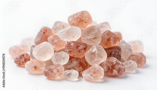 Pile of raw pink Himalayan salt crystals isolated on white background