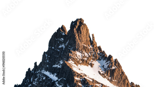 Tableau sur toile Jagged rocky mountain peak with patches of snow and textured brown rock face, is