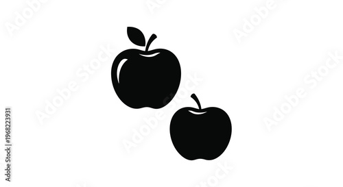 Two black apples displayed as a striking artistic silhouette