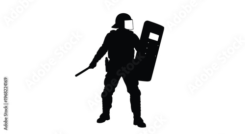 Riot police officer standing guard with shield a stark silhouette