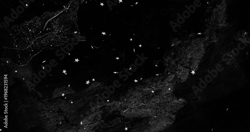 Displaying cluster of white five-pointed stars and speckles across night sky, marble texture