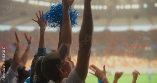 Diverse Happy Soccer Fans Celebrate Together in a Packed stadium Cheering for Their Team During a Professional League Match and Major International Tournament, With a Lively Crowd and Field View.