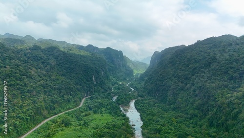 Bo Trach, Quang Binh (Quang Ngai), Vietnam: 4K aerial drone footage of Phong Nha – Ke Bang National Park, UNESCO karst mountains, limestone cliffs, rive, tropical forest, misty valley landscape.