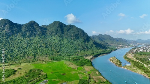 Canvas Print Phong Nha – Ke Bang National Park, Bo Trach, Quang Binh, Central Vietnam – 4K aerial footage of UNESCO Heritage site with Son River, limestone karst mountains, rice fields, tropical forest and cave
