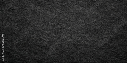 A dark macro texture of rough black leather and textile fabric material creates a blank grunge pattern backdrop for a sleek grey wallpaper design