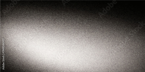 A grainy gradient evokes a sense of somber stillness in a photographic study of light and shadow, capturing a monochromatic view.